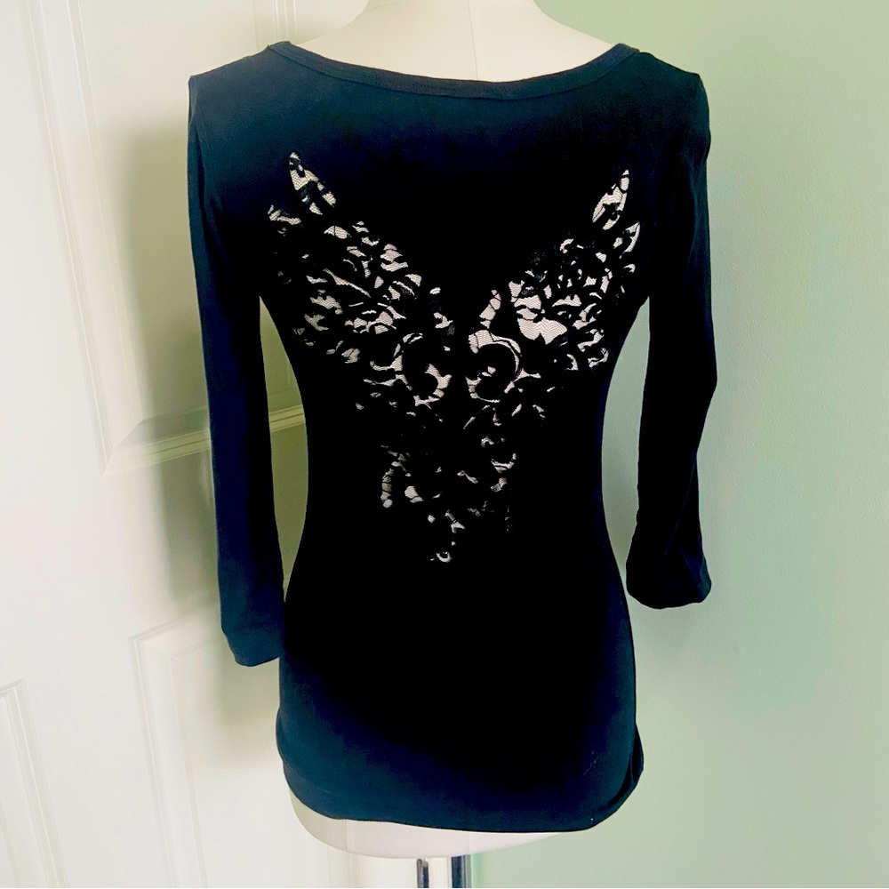 Like new Black 3/4 sleeve Designer tee with lace cut outs in back